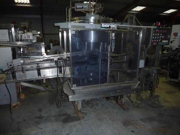 Remplisseuse liquide d'occasion SERAC R6V/720 - rotative avec 6 becs de remplissage_0