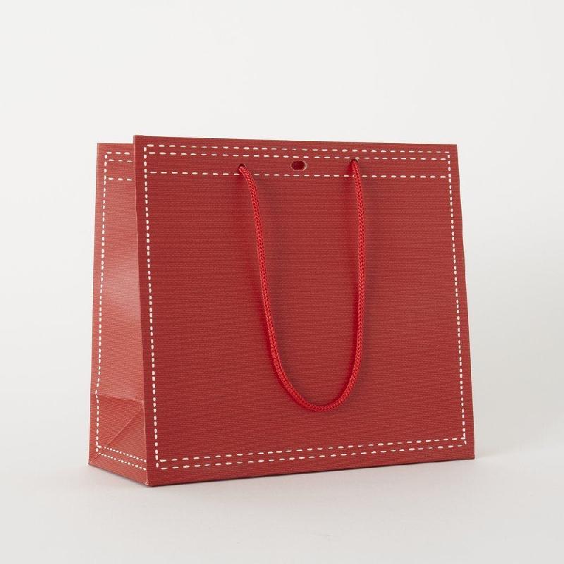 Sac papier rouge poignées corde/oeillet 25x10x22 cm - par 12_0