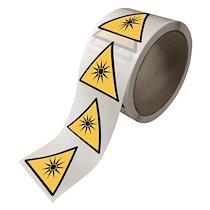 ROULEAU DE PICTOGRAMMES DE DANGER W027 RAYONNEMENT OPTIQUE VINYLE COTE 100 MM / 250