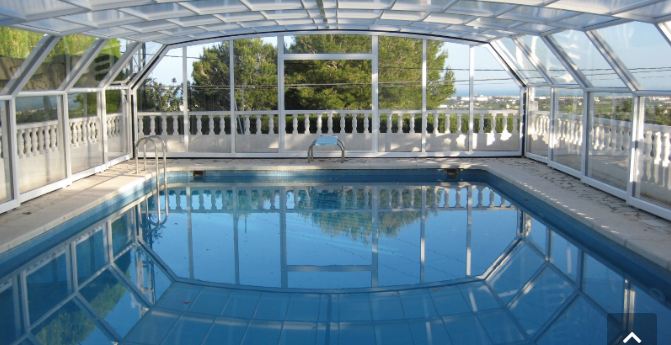 Abri piscine télescopique motorisé - aluminium thermolaqué et polycarbonate anti-UV - Paris_0