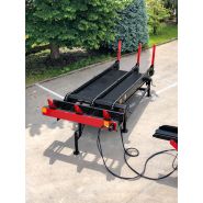 Chargeur de grumes à chaînes pour alimentation de ligne bois