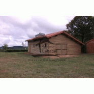 Garage ouvert avec une partie bardée, réalisée en pin maritime des landes