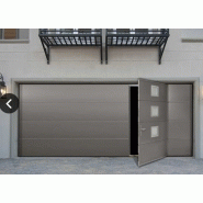 Porte de garage sectionnelle maori / motorisée / ouverture plafond / en acier / avec portillon et hublot / isolation thermique / étanche à l'air