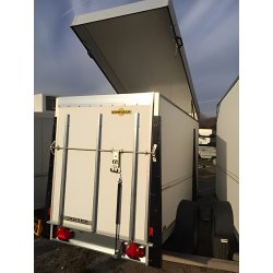 Remorque fourgon humbaur type hku avec capot de toit relevable sur compas à gaz.