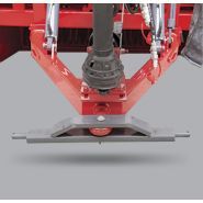 Appareil de ramassage de pierres avec bras hydrauliques