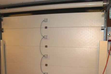 Porte de garage anti-effraction pare-balles et anti-explosif, avec fermeture hermétique et motorisation solide - Ultimium_1