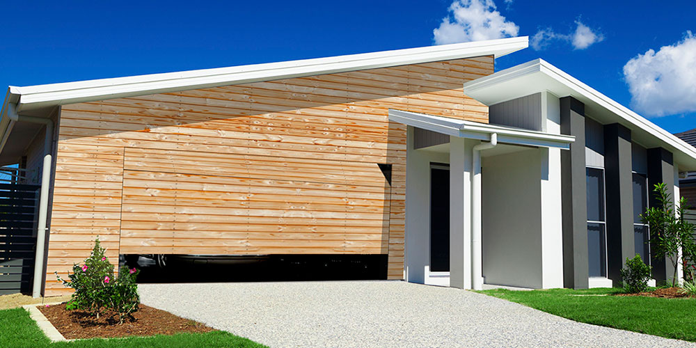 Porte de garage sectionnelle affleurante Kaméléo - finition lames aluminium design Renson - protection anti pince-doigts_1