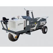 Vue latérale de la dérouleuse pailleuse automotrice Calvet