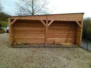 Garage avec bûcher en bois Douglas - GAR002 - 2 portes basculantes motorisées - Fabrication française_1