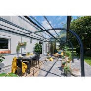 Abri de terrasse offrant un accès simplifié sans profil au sol