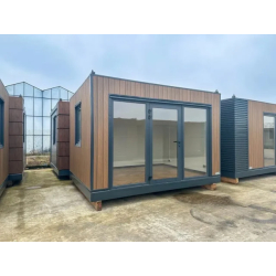 Studio de jardin reconditionné 12 m² - Isolation PIR 100 mm - Finition bois berlinois & RAL 7016 - Grandes surfaces vitrées - Électricité intégrée - Sol vinyle chêne