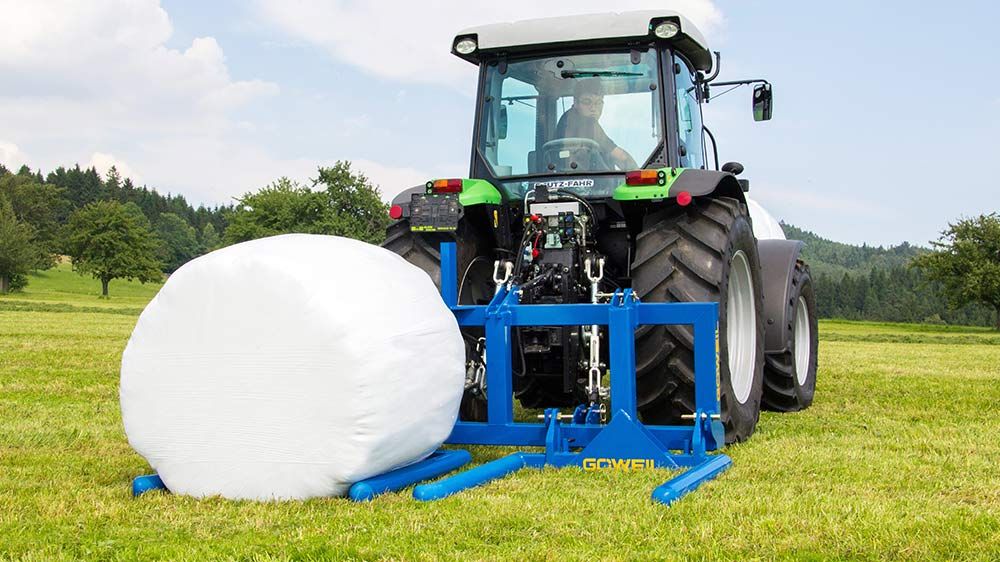 Cadre de transport pour balles rondes avec attelage trois points