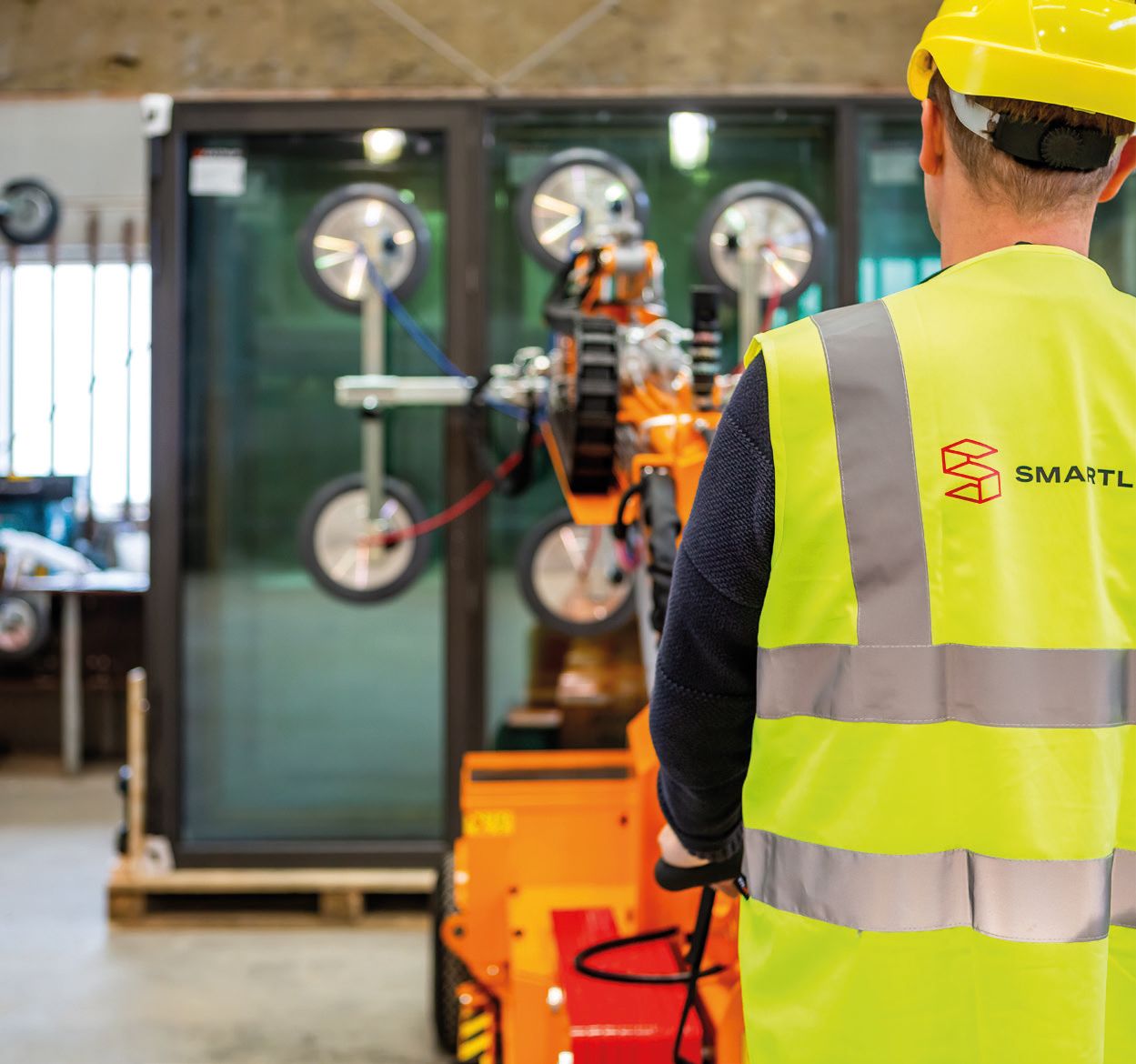 Appareil de levage de vitrages avec système hydraulique précis