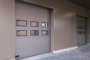 Porte sectionnelle industrielle Urban - repliable en plafond - pleine - en métal - isolation thermique - relevées standard, semi-verticale et verticale_2