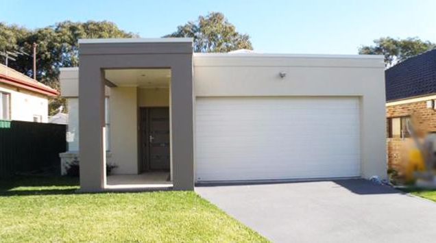 Porte de garage enroulable / motorisée / lames en acier / avec portillon et hublots / isolation thermique_2