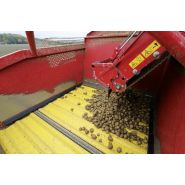 Machine déportée pour récolte avec pneus larges pour traction