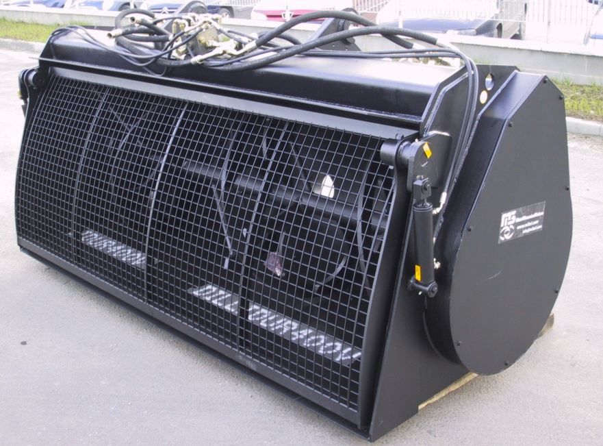 Godet malaxeur équipé d'une ouverture hydraulique de la trappe