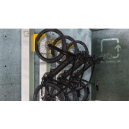 Système mécanique de stationnement vertical pour vélos avec assistance 