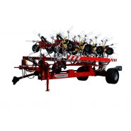 Faneuse traînée avec positionnement rapide en fourrière