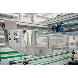 Ensacheuse automatique pour jerricanes - avec tapis transporteur et trois barres soudeuses