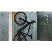Système mécanique de stationnement vertical pour vélos avec assistance 