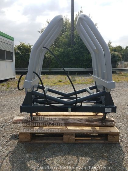 Pince pour balles rondes enrubannées, version télescopique disponible