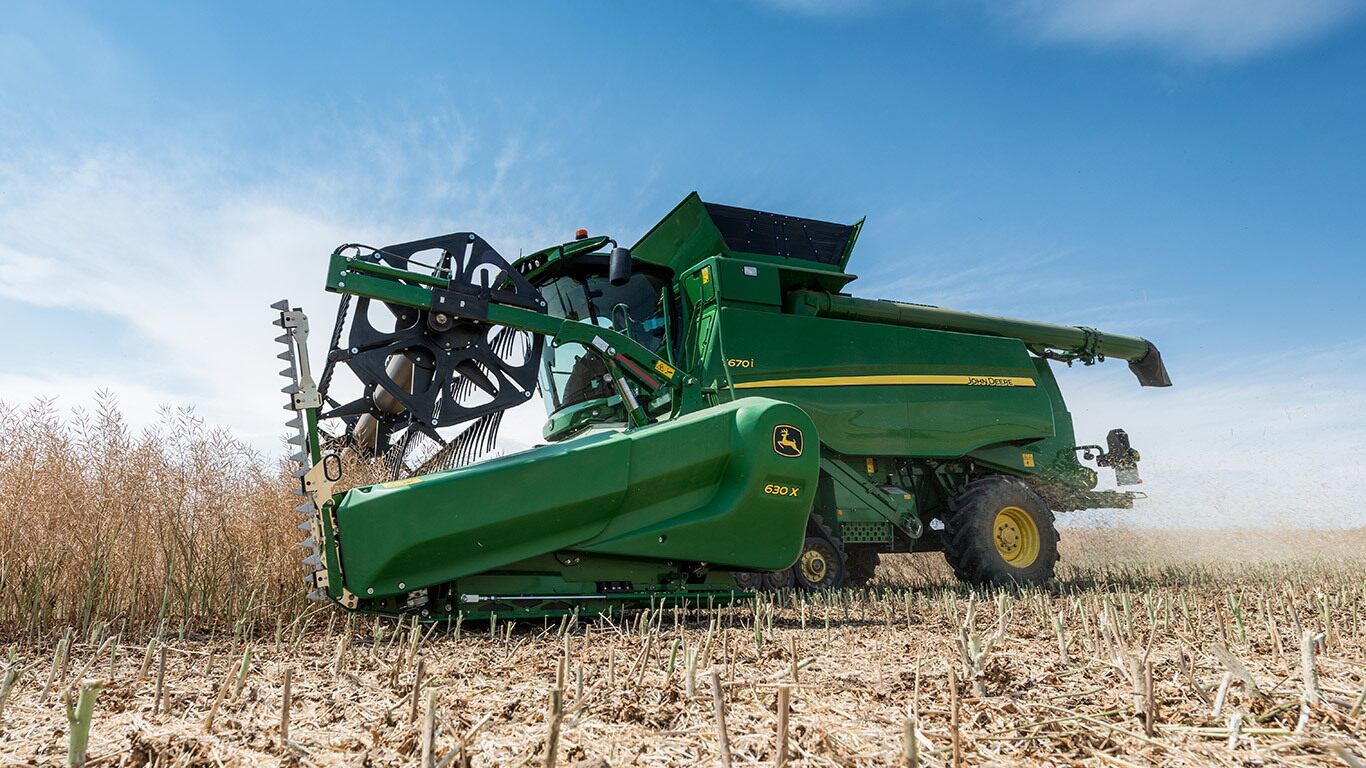 John Deere T560 avec vidange rapide de la trémie à 125 L/s